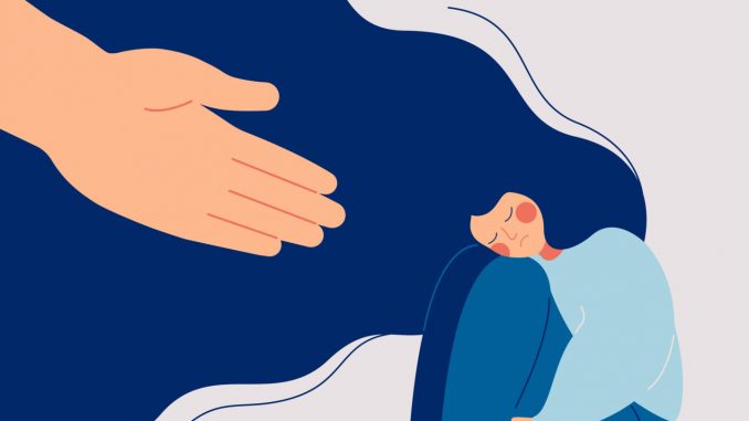 Human hand helps a sad lonely woman to get rid of depression